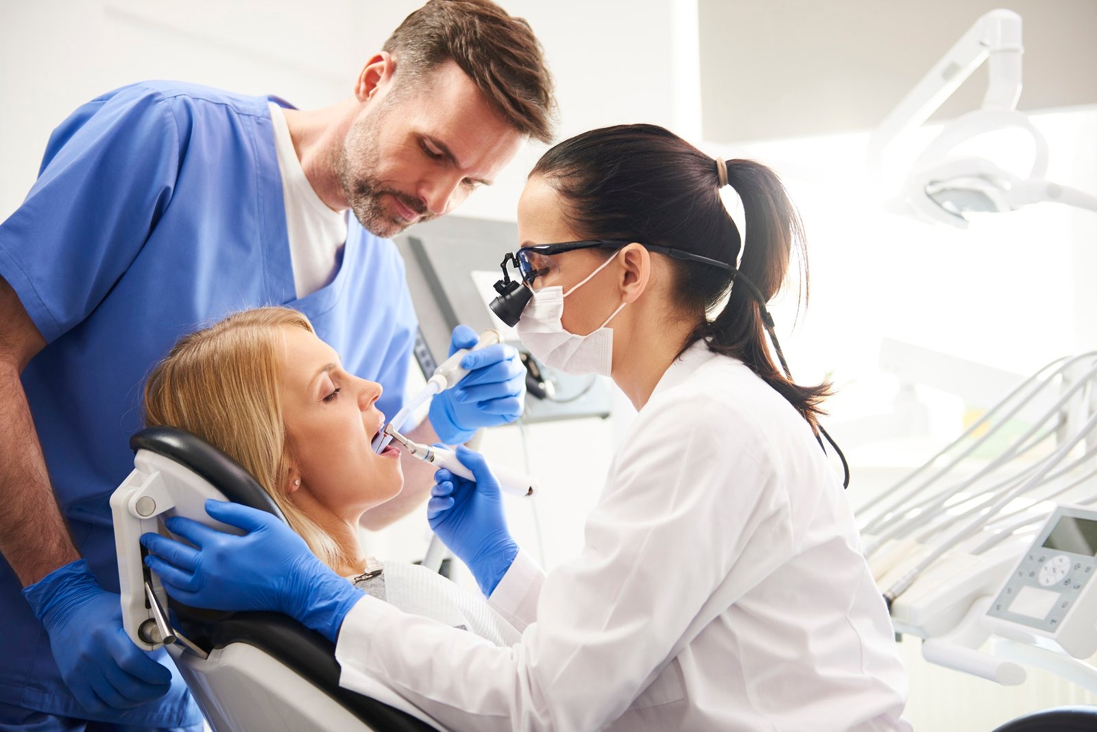 dentist-and-her-assistant-doing-their-work-in-dentist-s-clinic.jpg