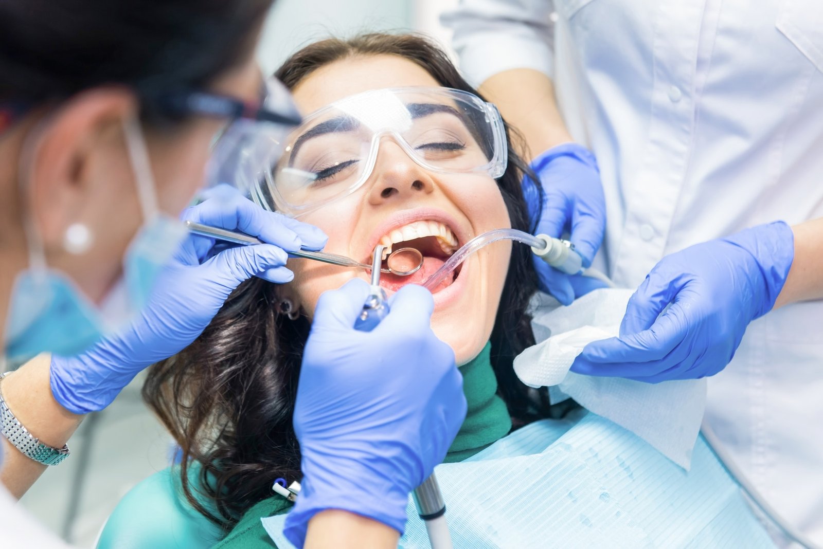 two-dentists-busy-with-patient.jpg